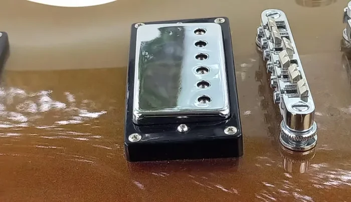 For rust, apply a small amount of white vinegar to the affected area with a Q-tip. Let it sit for 30 minutes, then wipe off with a clean cloth. For severe rust, consider replacing the pickup cover.