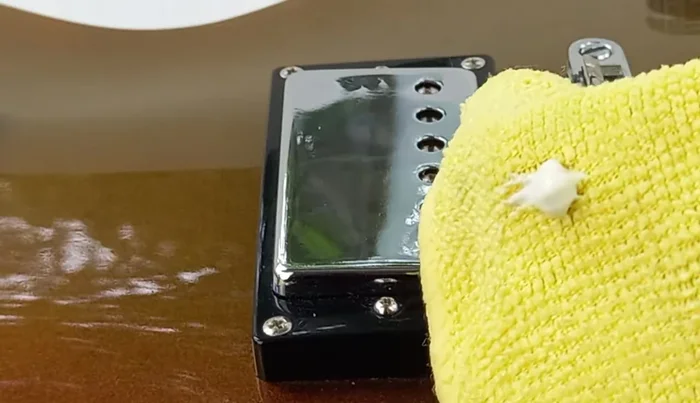 Apply a thin layer of guitar polish, let it haze, then polish off with small circular motions.