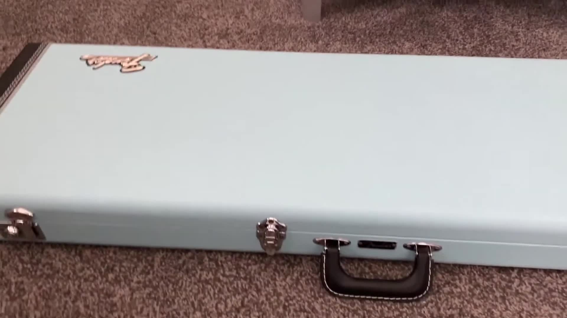 The reviewer holding the Fender Classic Series guitar case