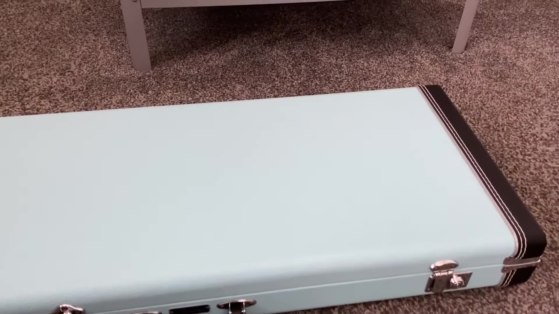 Close-up of the sonic blue Fender Classic Series guitar case