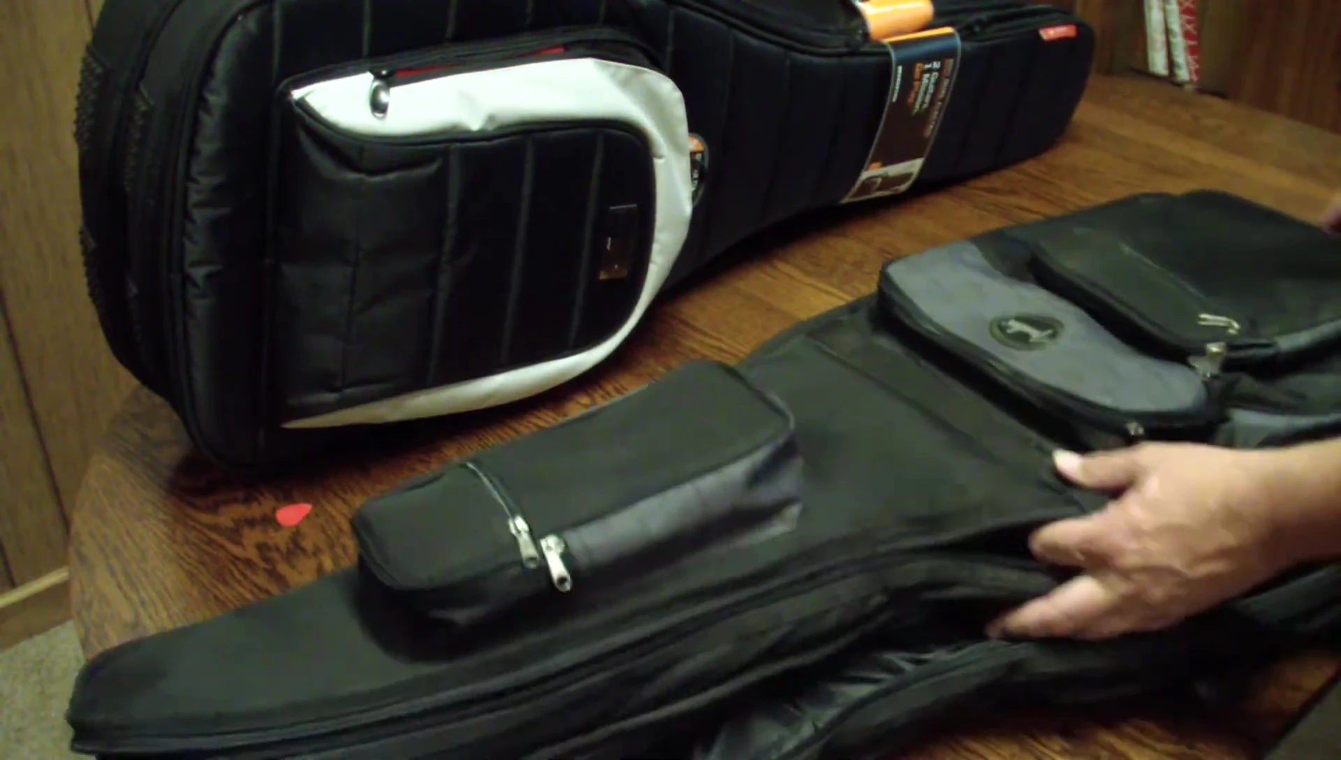 The reviewer comparing both bags side-by-side