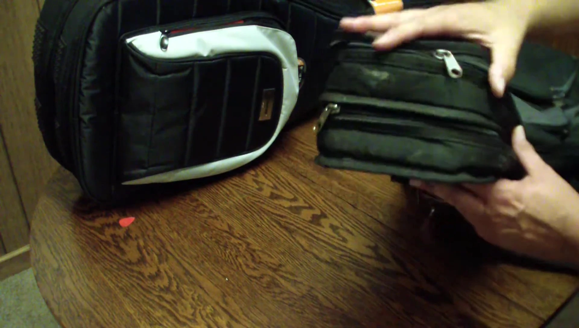 The reviewer demonstrating the different zipper designs