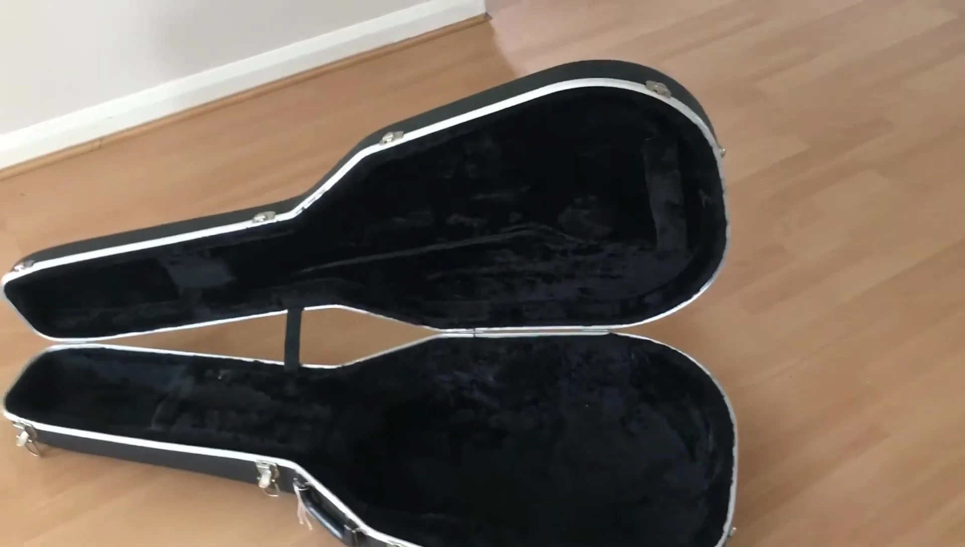The speaker emphasizing the guitar's player condition.