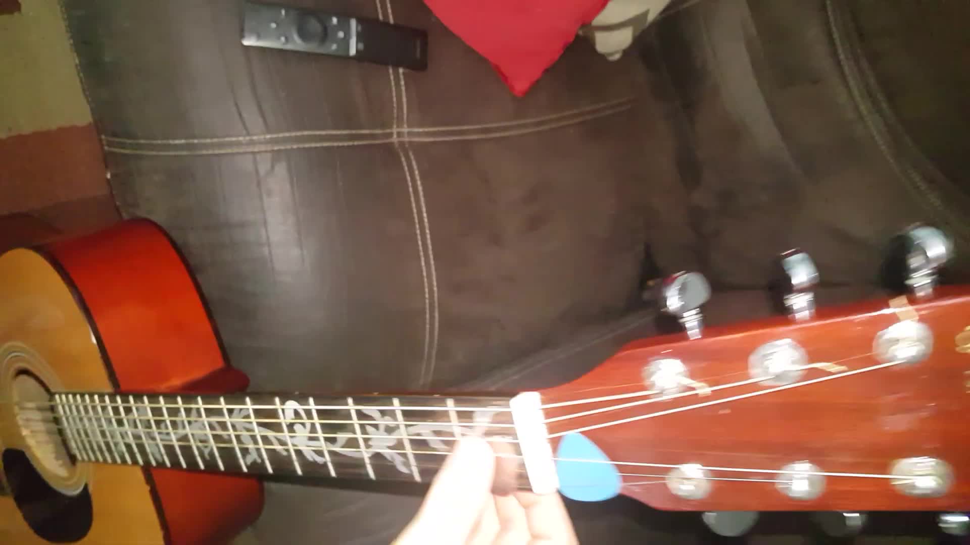 Guitarist playing the guitar with the 8-month-old Elixir Nanoweb strings.