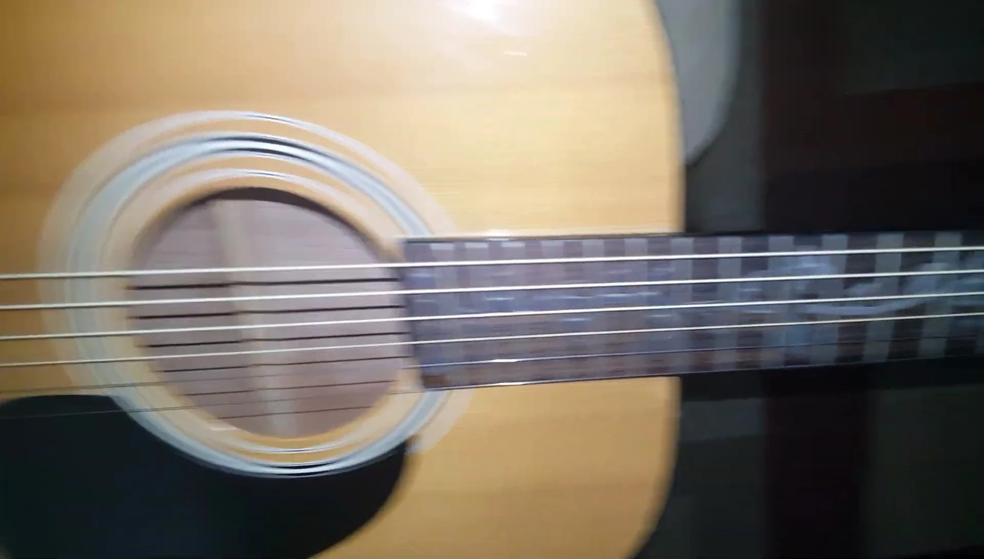Close-up shot of newly installed Elixir Polyweb strings.