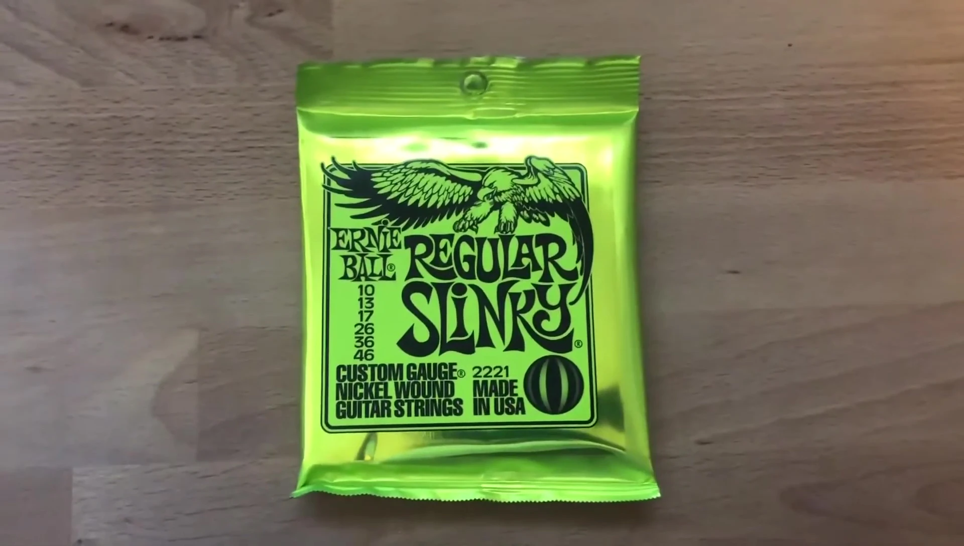 Close-up of Ernie Ball Regular Slinky packaging.