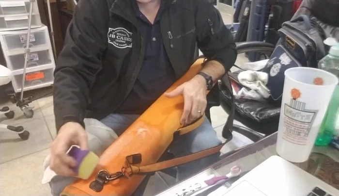 Gently scrub the case with the sponge. Avoid harsh scrubbing to prevent fiber damage.