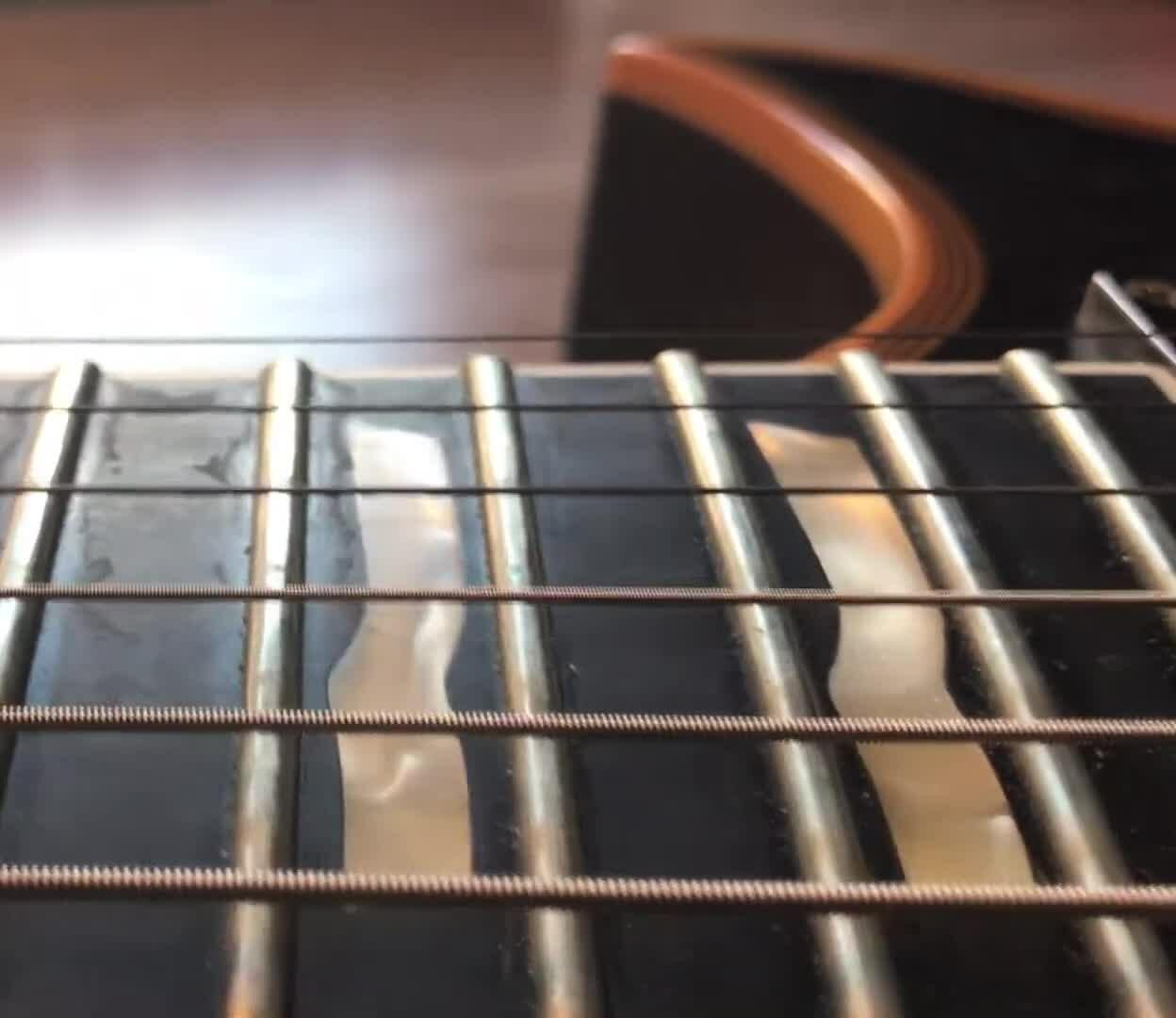 Close-up of Ernie Ball strings showing grime buildup on the higher strings after four months of use.