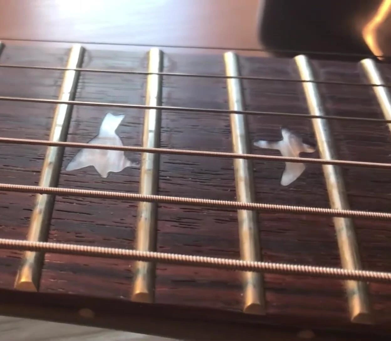 Close-up of the Elixir strings, highlighting the minimal wear on the thick E string.