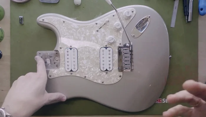 Remove strings and inspect saddles individually for burrs or sharp string grooves.