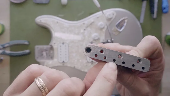 Remove the saddles and trim block to check for burrs where the block meets the saddles. Use abrasive cord or files to smooth any burrs.