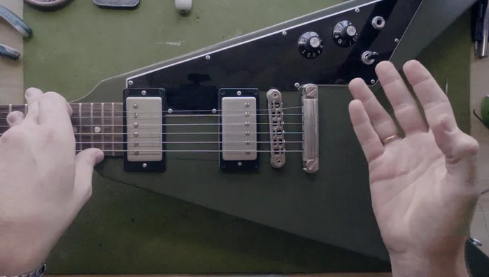 Use nut slotting files (round-edged preferred) very lightly to smooth the saddle channel.