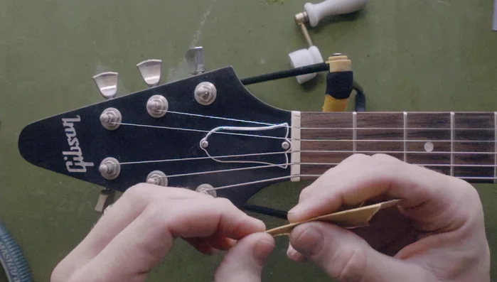 Follow up with fine-grit sandpaper (400 or 600) and micro-mesh pads to smooth the post.