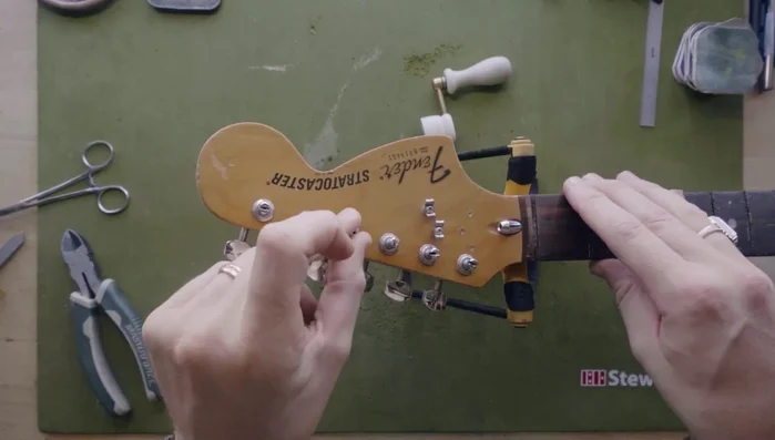 Inspect the string tree for sharp points or burrs using your fingernail.