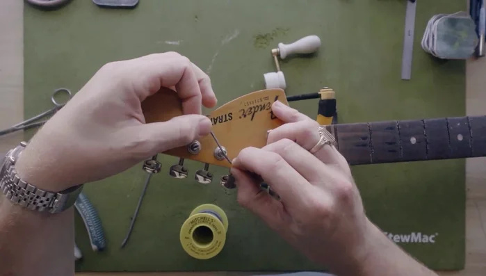 Use Mitchell's Abrasive Cord to floss the string tree slots to smooth any sharp edges.