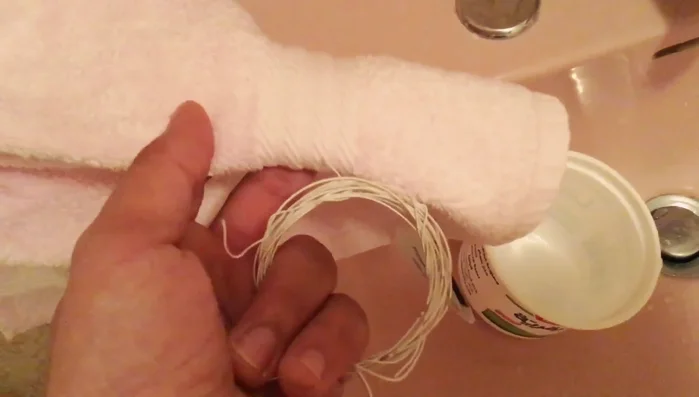 Re-install the strings onto your guitar, maintaining the original winding.