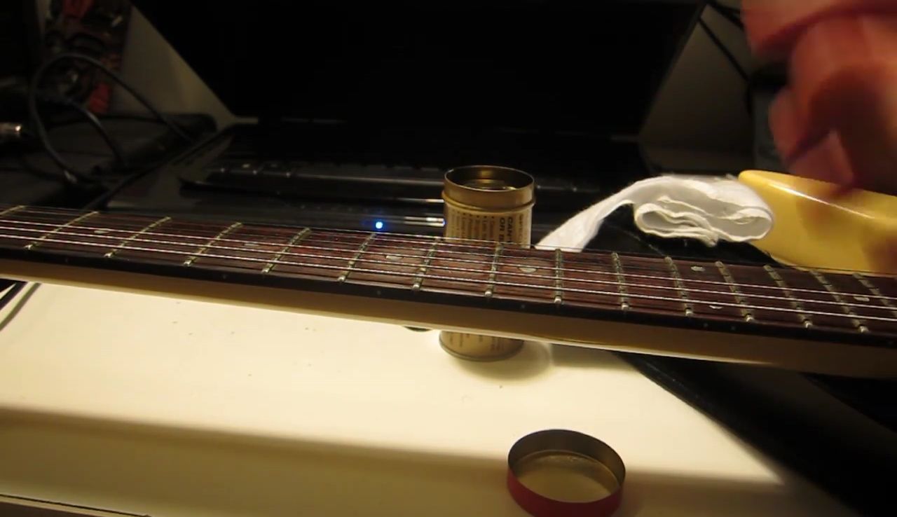 Illustrative comparison with spray-on application for better fretboard coverage.