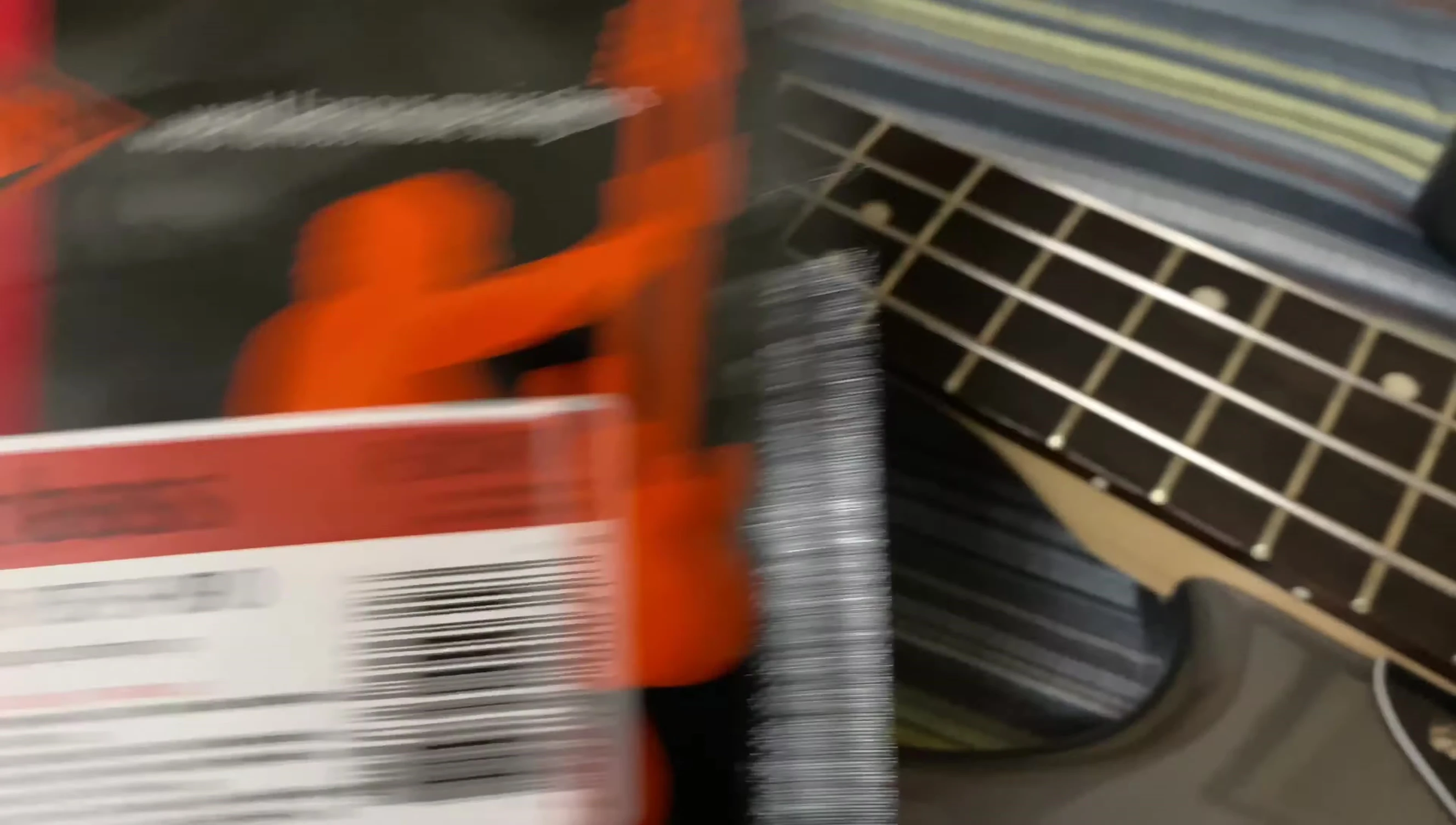 Close up of the hands playing the bass