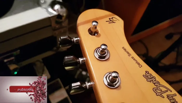 Remove the tuning peg nut and washer to access the spindle.