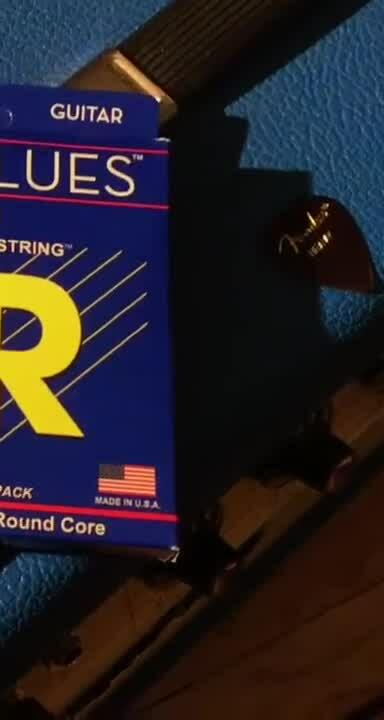 Close-up shot of the DR Pure Blues string packaging showcasing the gauges.