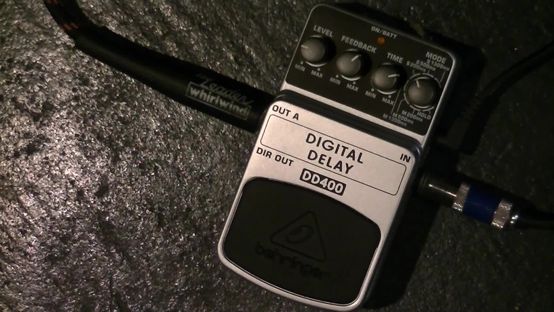 The reviewer holding the Behringer DD400 pedal.