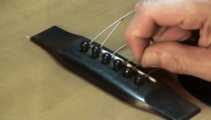 Pull the string; sometimes this will remove the pin.