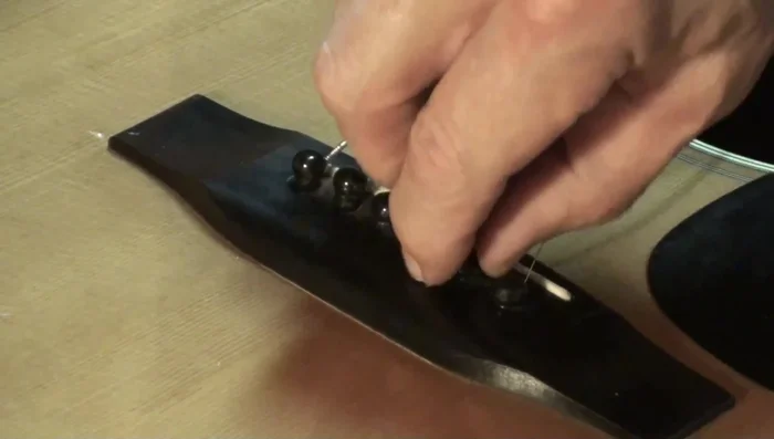 Pull the string; sometimes this will remove the pin.