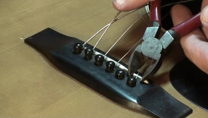 Slide the cutters up over the pin head.