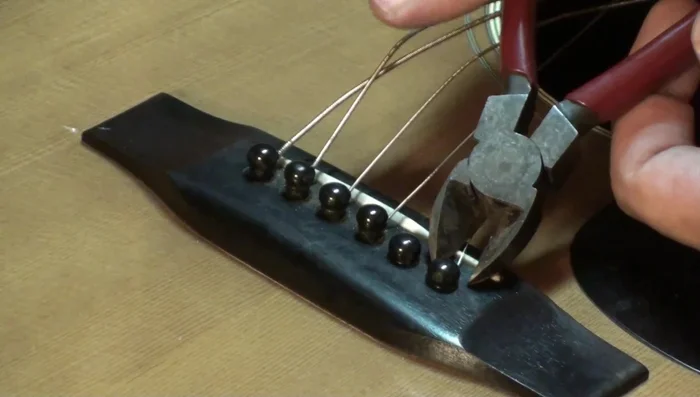 Slide the cutters up over the pin head.