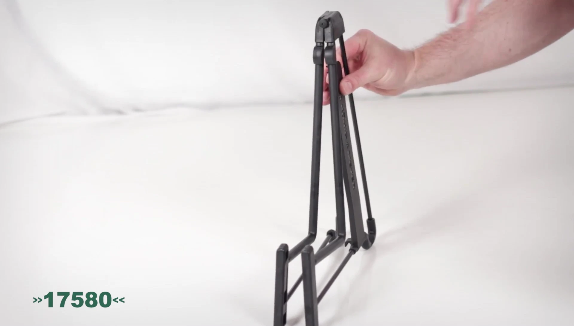 The Healey stand in its folded position, highlighting its compact design for easy transport.