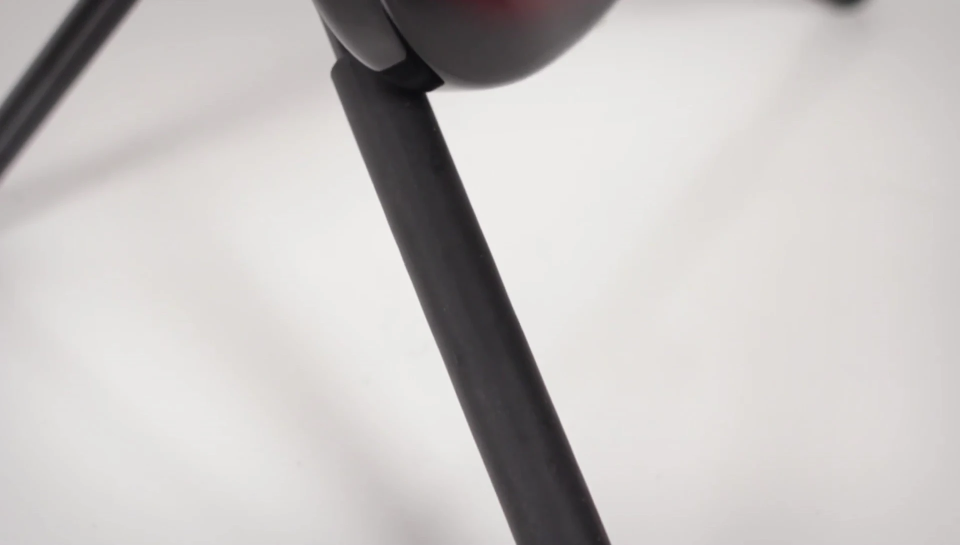 The rubberized support on the front legs, highlighting the scratch-free design.