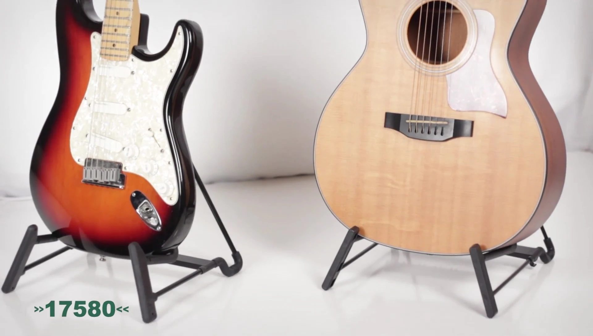 The Healey acoustic guitar stand showcasing its four-position design and ability to hold different instrument sizes.
