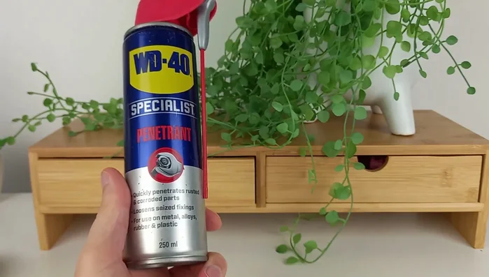 Lubricate both sides of the rocker hinge with WD-40. Work it in by moving the foot pedal back and forth.