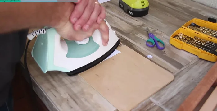 Apply a photocopy decal using an iron to transfer the reverse-printed image onto the wood.