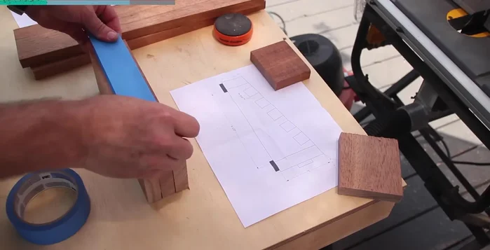 Assemble the main structure: Glue and clamp the maple strips and mahogany sides together. Pre-cut slots in the mahogany for the maple strips to ensure a precise fit.