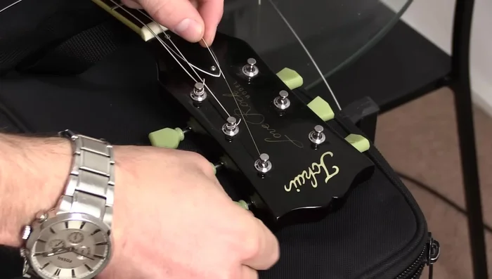 For the D and G strings, use the top of the headstock as a reference point and repeat the process.