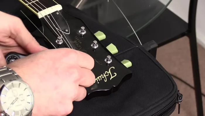 Always wind the strings towards the center of the guitar, regardless of whether you are left-handed or right-handed.
