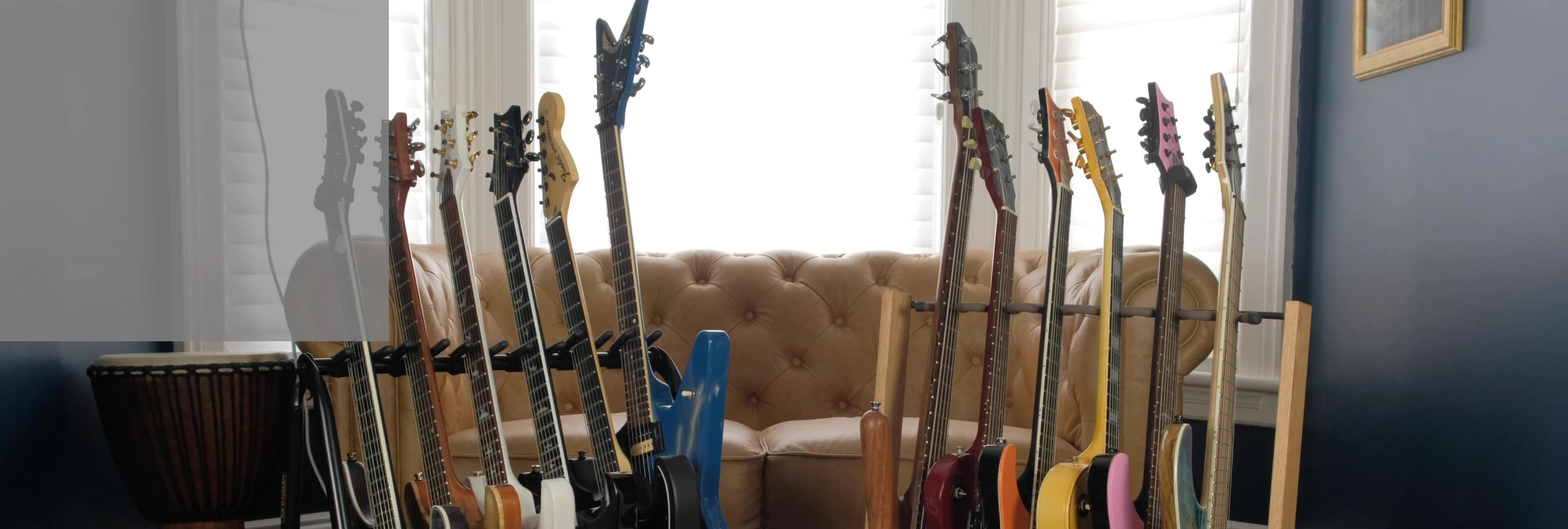 Close-up shot of the String Swing guitar rack highlighting its wooden construction.