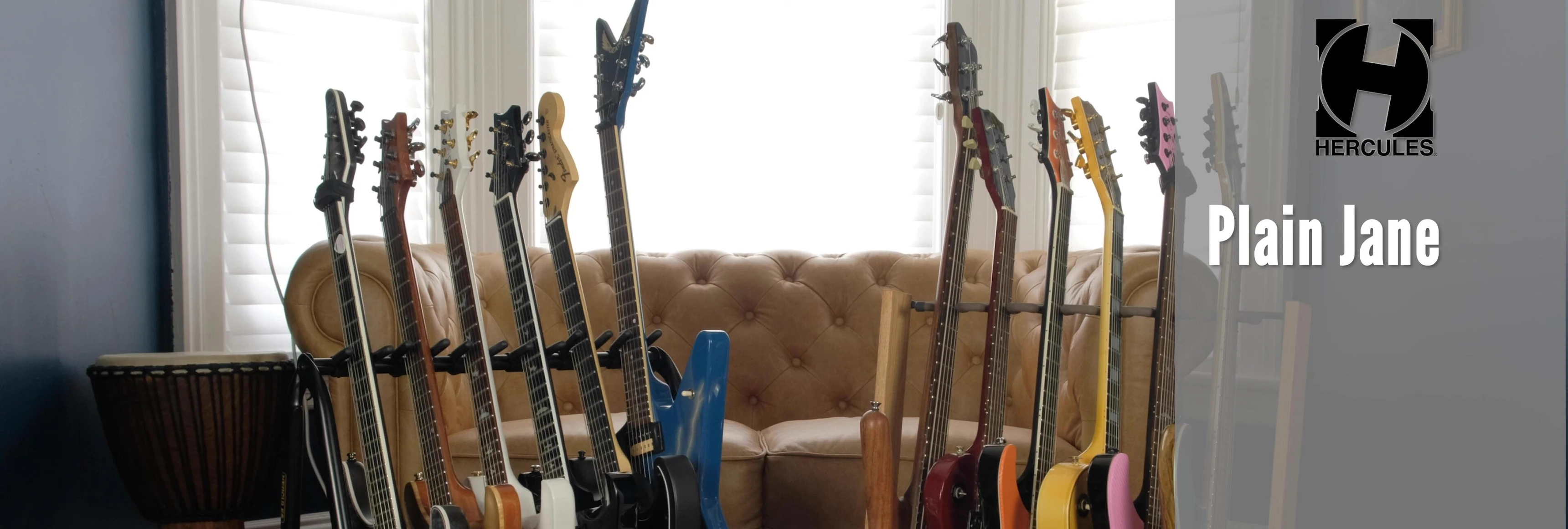 View of the Hercules guitar rack showcasing its black metal frame and yellow accents.