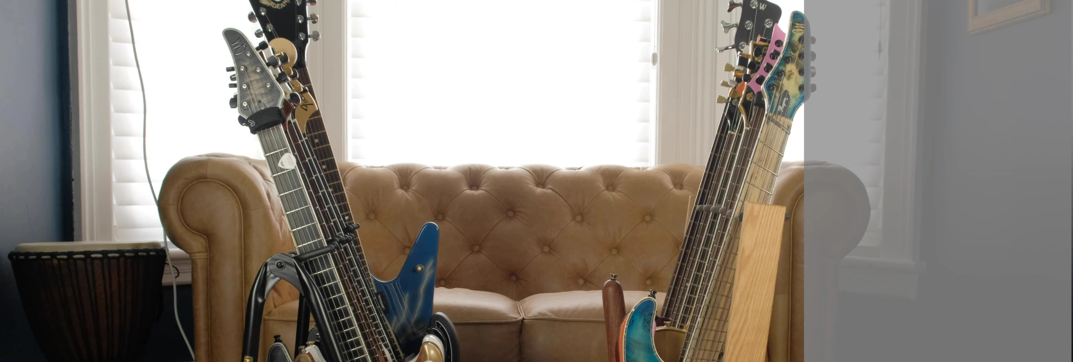 The Hercules rack with guitars, demonstrating the more pronounced angle and stability.