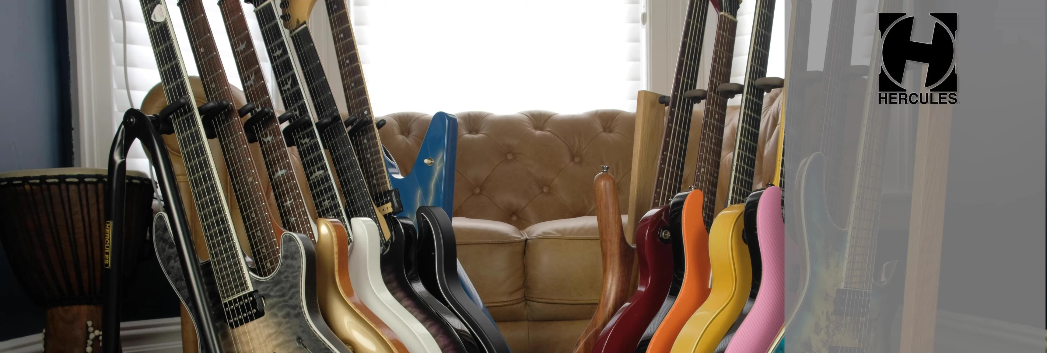 Dimensions of the Hercules guitar rack are displayed.