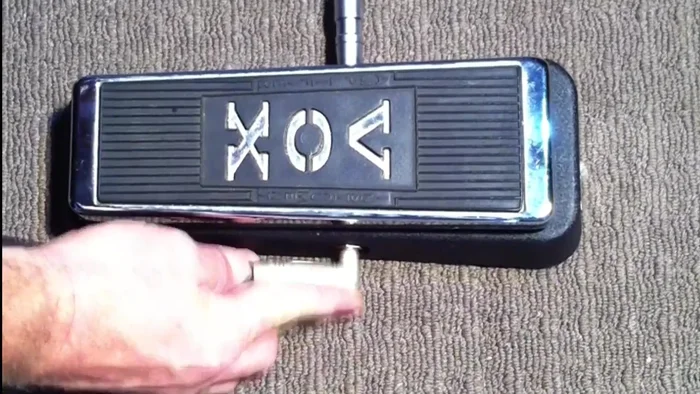 Plug the cable from your guitar into the input jack of your wah pedal (usually on the right). Remember: when a cable is plugged into the input, the pedal is on and will drain the battery if left connected for long periods.