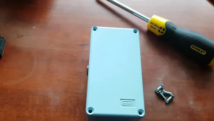Find a thin, strong object that can fit under the battery (the narrator used a docket).