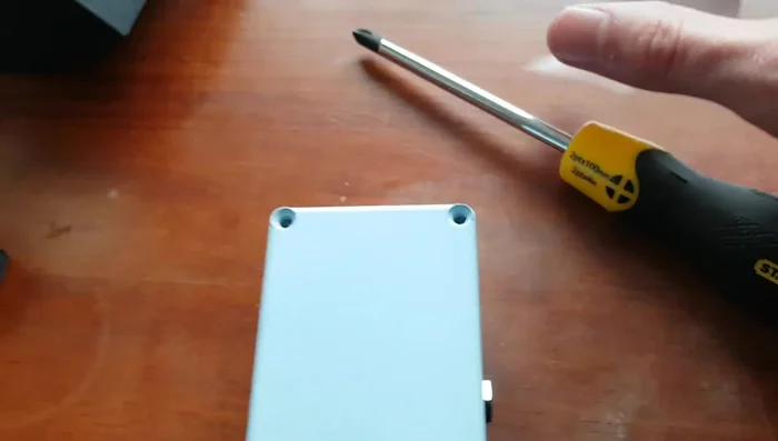 Slowly and carefully pull the battery out. Avoid using excessive force to prevent damage.