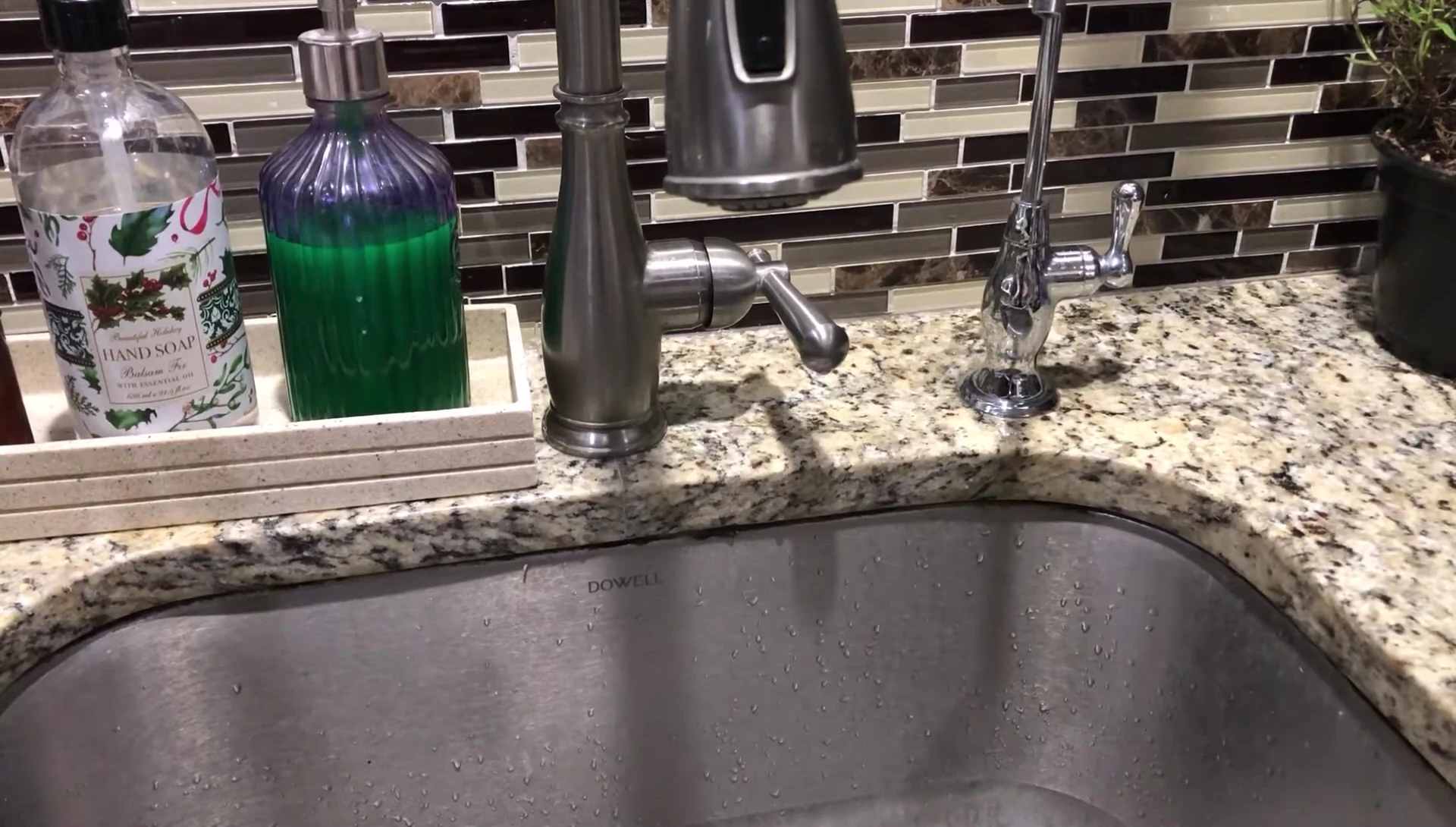Soaking the sponge in a bucket