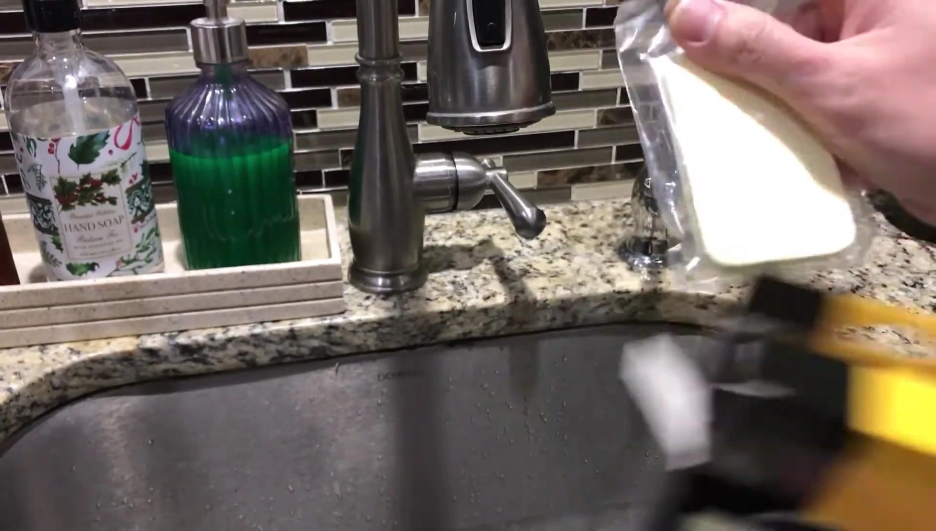 The sponge next to a regular kitchen sponge
