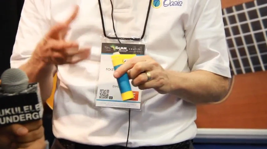 Person demonstrating the use of the syringe to fill the humidifier.