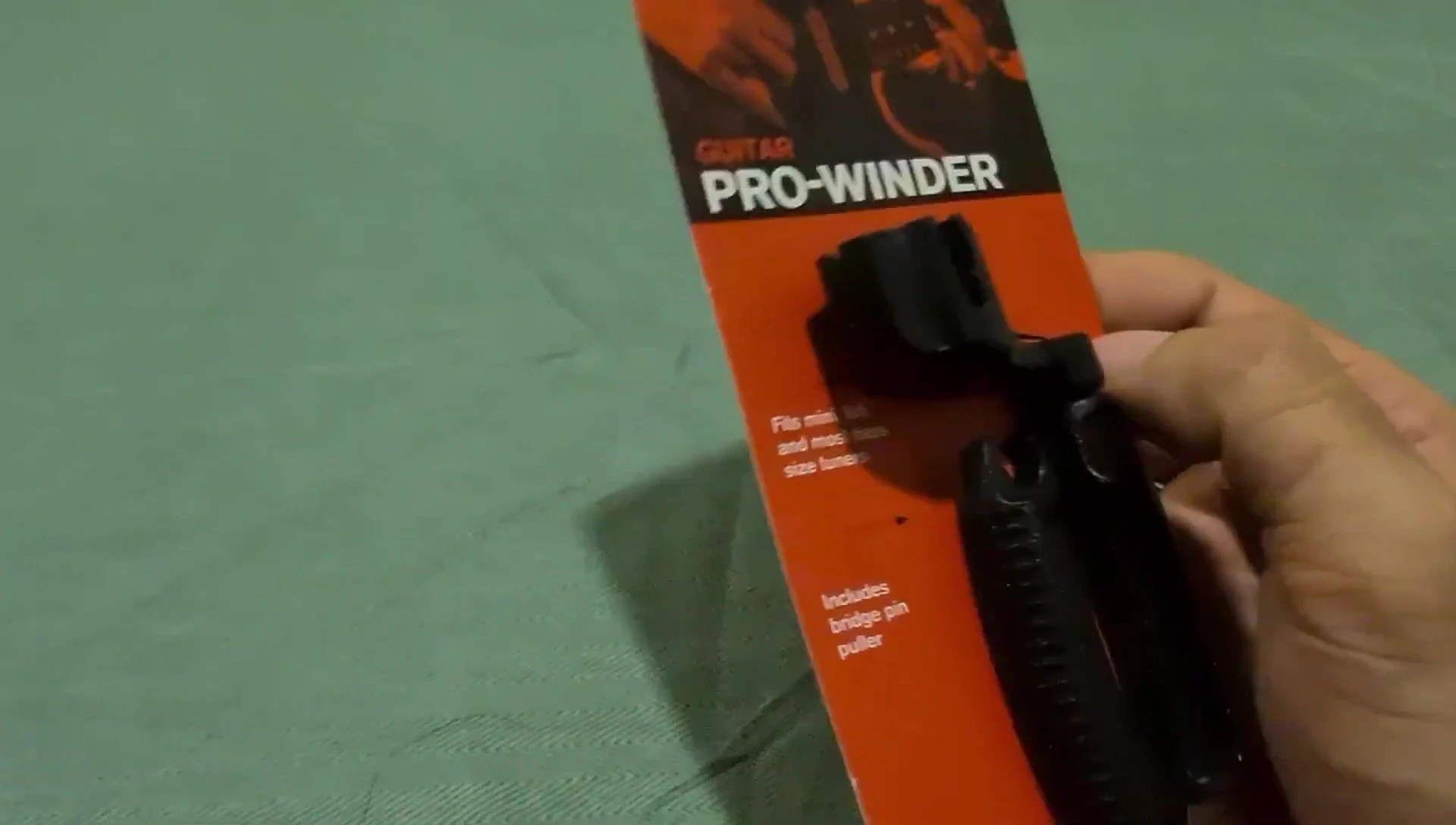 Close-up showing the bridge pin puller in action