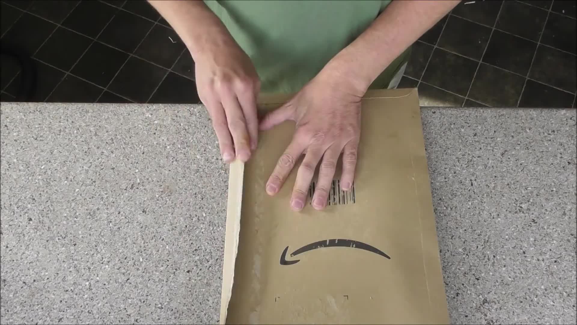 Close-up of the unboxing process, showcasing the tool's initial appearance.