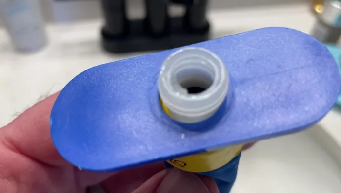 Refill the humidifier with water using a syringe to avoid spilling.